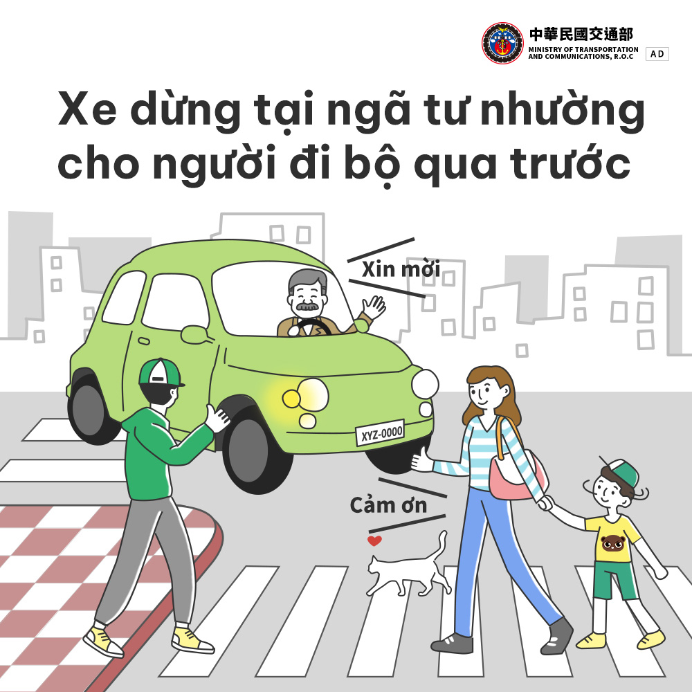 Xe dừng tại ngã tư nhường cho người đi bộ qua trước